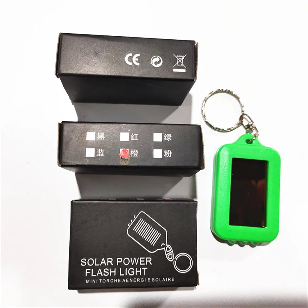 Solar-Powered LED Flashlight Keychain – Portable Emergency Light for Camping & Survival