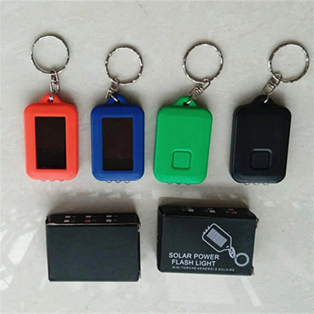 Solar-Powered LED Flashlight Keychain – Portable Emergency Light for Camping & Survival